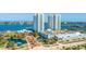 Aerial view of two highrise towers, parking, and waterfront landscape at 231 Riverside Dr # 1904, Daytona Beach, FL 32117