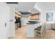 Modern kitchen with light wood cabinets and granite countertops at 231 Riverside Dr # 1904, Daytona Beach, FL 32117