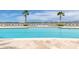 Inviting community pool with ample lounge chairs and waterfront views at 231 Riverside Dr # 1904, Daytona Beach, FL 32117