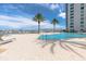 Refreshing pool with surrounding lounge chairs and building views at 231 Riverside Dr # 1904, Daytona Beach, FL 32117