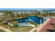 Aerial view of Marina Grande community, featuring a pond, fountain, and lush landscaping at 231 Riverside Dr # 1904, Daytona Beach, FL 32117