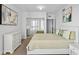 Main bedroom with large bed, dresser and mirrored closet doors at 231 Riverside Dr # 1904, Daytona Beach, FL 32117