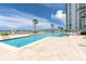 Resort-style pool with plenty of lounge chairs and water views at 231 Riverside Dr # 1904, Daytona Beach, FL 32117