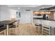Bright dining area adjacent to a modern kitchen at 231 Riverside Dr # 1904, Daytona Beach, FL 32117