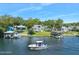 Aerial view of the home and its waterfront location with boat at 235 Coquina Ave, Ormond Beach, FL 32174