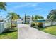 Two-story home with gated entrance and palm trees at 235 Coquina Ave, Ormond Beach, FL 32174