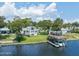Waterfront home with pool, dock, and lush landscaping at 235 Coquina Ave, Ormond Beach, FL 32174