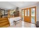 Inviting entryway with hardwood floors, staircase, and wooden door at 235 Coquina Ave, Ormond Beach, FL 32174