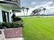 Backyard view with lush grass and waterfront access at 64 Ocean Palm S Dr # 64, Flagler Beach, FL 32136