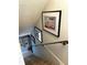 Staircase with framed nautical artwork and wall decor at 64 Ocean Palm S Dr # 64, Flagler Beach, FL 32136