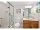 Clean bathroom with walk-in shower and single vanity at 1513 Ocean Shore Blvd # 6C, Ormond Beach, FL 32176