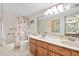Double vanity bathroom with a tub and shower at 1513 Ocean Shore Blvd # 6C, Ormond Beach, FL 32176