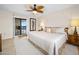 Main bedroom with king bed and sliding doors to private balcony at 1513 Ocean Shore Blvd # 6C, Ormond Beach, FL 32176