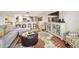 Bright living room features comfortable seating, large TV, and stylish decor at 1513 Ocean Shore Blvd # 6C, Ormond Beach, FL 32176