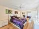 Bedroom with a queen-size bed, hardwood floors and mirrored closet at 2600 Ocean Shore Blvd # 3060, Ormond Beach, FL 32176