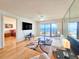 Living room with ocean view, hardwood floors, and comfortable seating at 2600 Ocean Shore Blvd # 3060, Ormond Beach, FL 32176