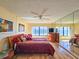 Main bedroom with ocean view, king bed, and mirrored closet at 2600 Ocean Shore Blvd # 3060, Ormond Beach, FL 32176
