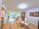 Bright dining area with glass table and four white chairs at 2600 Ocean Shore Blvd # 3060, Ormond Beach, FL 32176