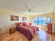 Bedroom with ocean view, king-size bed, and hardwood floors at 2600 Ocean Shore Blvd # 3060, Ormond Beach, FL 32176