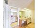 Double vanity bathroom with wood cabinets and a yellow rug at 2600 Ocean Shore Blvd # 3060, Ormond Beach, FL 32176
