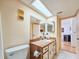 Clean bathroom with a vanity, toilet, and mirrored medicine cabinet at 2600 Ocean Shore Blvd # 3060, Ormond Beach, FL 32176