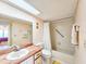 Bathroom with shower/tub combo, wood vanity and a white curtain at 2600 Ocean Shore Blvd # 3060, Ormond Beach, FL 32176