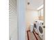 Laundry room with washer, dryer, and storage cabinets at 2600 Ocean Shore Blvd # 3060, Ormond Beach, FL 32176
