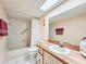 Bathroom with a single vanity, wood cabinets and a tub at 2600 Ocean Shore Blvd # 3060, Ormond Beach, FL 32176