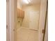 Laundry room with upper cabinets and tiled floor at 10224 Hart Branch Cir, Orlando, FL 32832