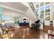Bright living area with hardwood floors, large windows, and a view of the water at 70 Riverside Dr, Ormond Beach, FL 32176