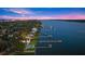 Night aerial view of waterfront home with pool and private dock at 70 Riverside Dr, Ormond Beach, FL 32176