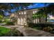 Beautiful waterfront home with lush landscaping at 70 Riverside Dr, Ormond Beach, FL 32176