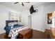 Bright bedroom with hardwood floors, a ceiling fan and lots of natural light at 70 Riverside Dr, Ormond Beach, FL 32176