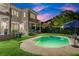 Inviting kidney-shaped pool with patio and lush landscaping at 70 Riverside Dr, Ormond Beach, FL 32176