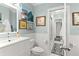 Spa-like bathroom with white vanity, toilet, and shower at 70 Riverside Dr, Ormond Beach, FL 32176