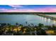 Night aerial view of waterfront home, bridge and city lights at 70 Riverside Dr, Ormond Beach, FL 32176