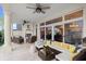 Outdoor patio with seating area and fireplace at 70 Riverside Dr, Ormond Beach, FL 32176