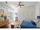 Bedroom with hardwood floors, built in shelving and access to balcony at 70 Riverside Dr, Ormond Beach, FL 32176