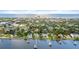 Aerial view showcasing a luxurious waterfront home and surrounding neighborhood at 70 Riverside Dr, Ormond Beach, FL 32176