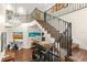Grand staircase with wrought iron railings and hardwood floors at 70 Riverside Dr, Ormond Beach, FL 32176