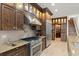 Modern kitchen with stainless steel appliances and granite countertops at 70 Riverside Dr, Ormond Beach, FL 32176