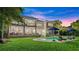 Large backyard with a spacious pool and patio area at 70 Riverside Dr, Ormond Beach, FL 32176