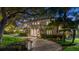 Elegant two-story home with a charming front entrance and landscaped grounds at 70 Riverside Dr, Ormond Beach, FL 32176