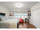 Bright bedroom with lake views and built-in shelving at 70 Riverside Dr, Ormond Beach, FL 32176