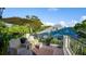 Relaxing patio with seating area, umbrella, and railing at 70 Riverside Dr, Ormond Beach, FL 32176