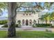 Elegant home with arched entryway and mature trees at 70 Riverside Dr, Ormond Beach, FL 32176