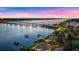 Night aerial view of a waterfront home with a bridge in the background at 70 Riverside Dr, Ormond Beach, FL 32176