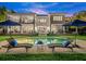 Relaxing pool area with lounge chairs and umbrellas at 70 Riverside Dr, Ormond Beach, FL 32176