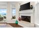 Fireplace with built-in shelving and water views at 70 Riverside Dr, Ormond Beach, FL 32176