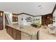 Open kitchen with island and views into the adjacent living area at 70 Riverside Dr, Ormond Beach, FL 32176